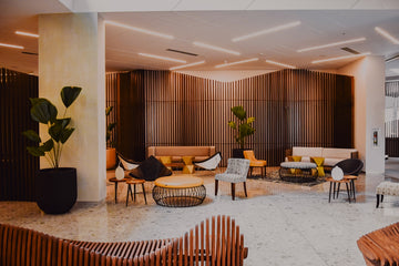 modern hotel lobby with designer furniture and wood walls