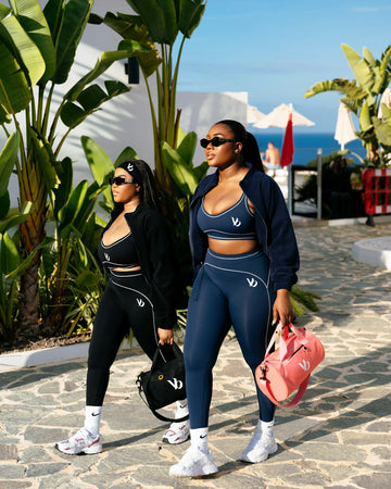 Two women in athletic wear walking outdoors