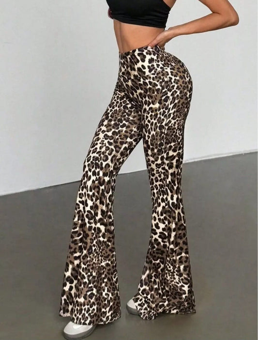 Leopard print flared pants worn by a person on a plain background