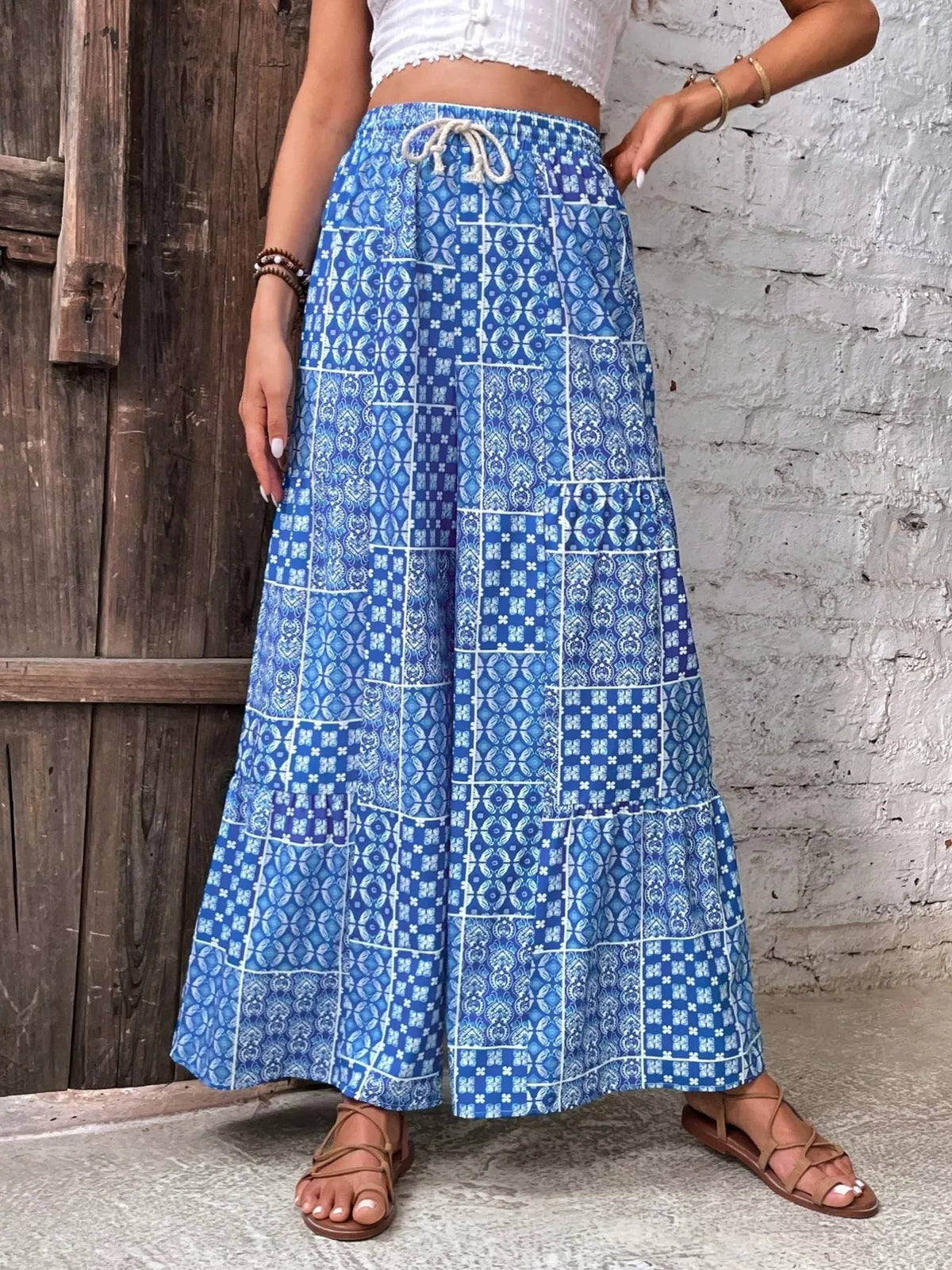Pantalon palazzo imprimé à taille haute avec cordon de serrage